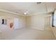 Large bedroom with multiple access points and abundant space for versatile furniture arrangements at 10761 Capesthorne Way, Las Vegas, NV 89135