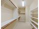Walk-in closet with shelving, storage, and carpet at 10761 Capesthorne Way, Las Vegas, NV 89135