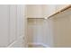 Spacious walk-in closet featuring rod for hanging clothes at 10761 Capesthorne Way, Las Vegas, NV 89135