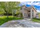 Beautiful two-story home featuring a basketball court, green lawn, and a manicured front yard at 10761 Capesthorne Way, Las Vegas, NV 89135