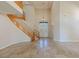 Grand foyer with travertine floors, high ceilings and a beautiful curved staircase at 10761 Capesthorne Way, Las Vegas, NV 89135