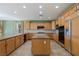 Modern kitchen with granite counters, wood cabinets, and stainless steel appliances at 10761 Capesthorne Way, Las Vegas, NV 89135