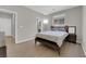 Bedroom featuring wood-look tile flooring, with access to ensuite bathroom at 11244 Gammila Dr, Las Vegas, NV 89141