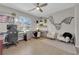 Bright bedroom with unique wall art and comfortable furniture, creating a welcoming space at 11244 Gammila Dr, Las Vegas, NV 89141