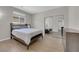 Bedroom featuring wood-look tile flooring, mirrored closet and ample natural light at 11244 Gammila Dr, Las Vegas, NV 89141