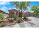 Inviting single-story home with desert landscaping and a convenient two-car garage at 11244 Gammila Dr, Las Vegas, NV 89141