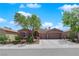 Charming single-story home with a well-manicured front yard and a two-car garage at 11244 Gammila Dr, Las Vegas, NV 89141