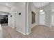 Inviting foyer with tile floors, neutral walls, a decorative wall fountain, and a stylish pendant light at 11244 Gammila Dr, Las Vegas, NV 89141