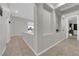 Bright hallway with tile flooring and views to the kitchen and entry at 11244 Gammila Dr, Las Vegas, NV 89141