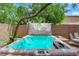 Backyard area featuring a modern hot tub with jets, providing an ideal space for relaxation at 11244 Gammila Dr, Las Vegas, NV 89141
