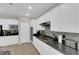Well-lit kitchen featuring stainless steel appliances, mosaic backsplash, and white cabinets at 11244 Gammila Dr, Las Vegas, NV 89141