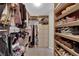 Walk-in closet featuring custom shelves and storage options at 11244 Gammila Dr, Las Vegas, NV 89141