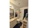 Bright bathroom with granite countertop vanity, shower-tub combo, and beach themed decorations at 1128 Willow Tree Dr # C, Las Vegas, NV 89128