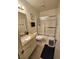 The bathroom has a shower over bath, sink and toilet at 1128 Willow Tree Dr # C, Las Vegas, NV 89128