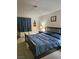 Cozy bedroom featuring a comfortable bed with dark wood frame and blue linens at 1128 Willow Tree Dr # C, Las Vegas, NV 89128
