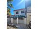 Two-story house with a red tile roof and small fenced yard at 1128 Willow Tree Dr # C, Las Vegas, NV 89128