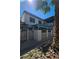 Two story home exterior with lattice fencing, covered patios, and low maintenance yard at 1128 Willow Tree Dr # C, Las Vegas, NV 89128