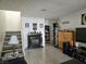 Cozy living room with tile flooring, decorative fireplace, and staircase at 1128 Willow Tree Dr # C, Las Vegas, NV 89128