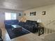 Cozy living room with matching sofas, coffee table, and neutral walls at 1128 Willow Tree Dr # C, Las Vegas, NV 89128