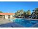 Sparkling community pool with clear blue water and inviting lounging area at 1128 Willow Tree Dr # C, Las Vegas, NV 89128