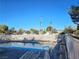 Relaxing community pool area with comfortable lounge chairs and a refreshing atmosphere at 1128 Willow Tree Dr # C, Las Vegas, NV 89128