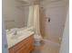 Bathroom featuring a shower/tub combo, and light wood vanity for storage at 1564 Silver Knoll Ave, Las Vegas, NV 89123