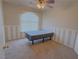 Bedroom with neutral carpet, a window, and decorative striped wall accents at 1564 Silver Knoll Ave, Las Vegas, NV 89123