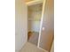 Walk-in closet featuring neutral carpet, ample space, and rows of hangers for organized storage at 1564 Silver Knoll Ave, Las Vegas, NV 89123