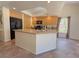 Bright kitchen boasts a large island with granite countertops, a black refrigerator and lots of storage at 1564 Silver Knoll Ave, Las Vegas, NV 89123
