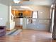 Spacious living room and open kitchen area with hardwood floors and lots of natural light at 1564 Silver Knoll Ave, Las Vegas, NV 89123