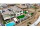 The property has a private backyard oasis featuring a pool, covered patio, artificial turf, and gazebo at 180 Native Stone St, Las Vegas, NV 89138