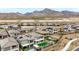 This aerial view shows a neighborhood with mountain views in the background at 180 Native Stone St, Las Vegas, NV 89138