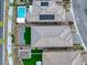 The aerial view reveals a meticulously landscaped backyard featuring turf, an outdoor kitchen, and a refreshing pool at 180 Native Stone St, Las Vegas, NV 89138