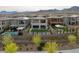 A backyard with modern landscaping, turf, and a gazebo, perfect for outdoor enjoyment and entertaining guests at 180 Native Stone St, Las Vegas, NV 89138