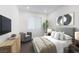 Comfortable bedroom with neutral tones, a large window, and tasteful decor at 180 Native Stone St, Las Vegas, NV 89138