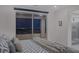 Bedroom with sliding glass doors showcasing the sparkling city views at 180 Native Stone St, Las Vegas, NV 89138