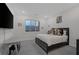 Simple bedroom featuring a full bed, side table, and window view at 180 Native Stone St, Las Vegas, NV 89138