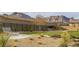 Serene community park with benches, a walking path, lush landscaping and mountain views at 180 Native Stone St, Las Vegas, NV 89138