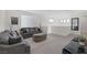 Cozy upstairs living area with plush seating, neutral tones, and ample natural light, perfect for relaxation at 180 Native Stone St, Las Vegas, NV 89138