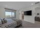 Bright Primary bedroom featuring a private balcony, en-suite bathroom, and modern accents for a luxurious retreat at 180 Native Stone St, Las Vegas, NV 89138