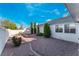 This backyard has low-maintenance desert landscaping with room to entertain at 2086 Angel Falls Dr, Henderson, NV 89074