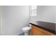 Modern bathroom features a toilet with dark counter and a bright window at 2086 Angel Falls Dr, Henderson, NV 89074