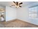 Bedroom with neutral carpet, a ceiling fan, and a window at 2086 Angel Falls Dr, Henderson, NV 89074
