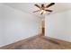 A cozy bedroom featuring a ceiling fan and neutral carpet at 2086 Angel Falls Dr, Henderson, NV 89074