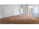 A carpeted room with white walls showing electrical sockets and doors to other rooms at 2086 Angel Falls Dr, Henderson, NV 89074