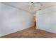 Bedroom with carpet, white walls, closet and ceiling fan at 2086 Angel Falls Dr, Henderson, NV 89074