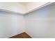 Walk-in closet space with shelving and neutral carpeting at 2086 Angel Falls Dr, Henderson, NV 89074