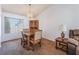 Cozy dining area with carpet floors, neutral walls, and wood furniture at 2086 Angel Falls Dr, Henderson, NV 89074