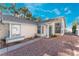 Attractive home exterior with desert landscaping, stylish windows, and a welcoming entrance at 2086 Angel Falls Dr, Henderson, NV 89074