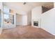 Inviting living room with cozy fireplace, vaulted ceiling, and plenty of natural light at 2086 Angel Falls Dr, Henderson, NV 89074